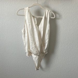 Abercrombie and Fitch bodysuit, never been worn. Cream colored and size M